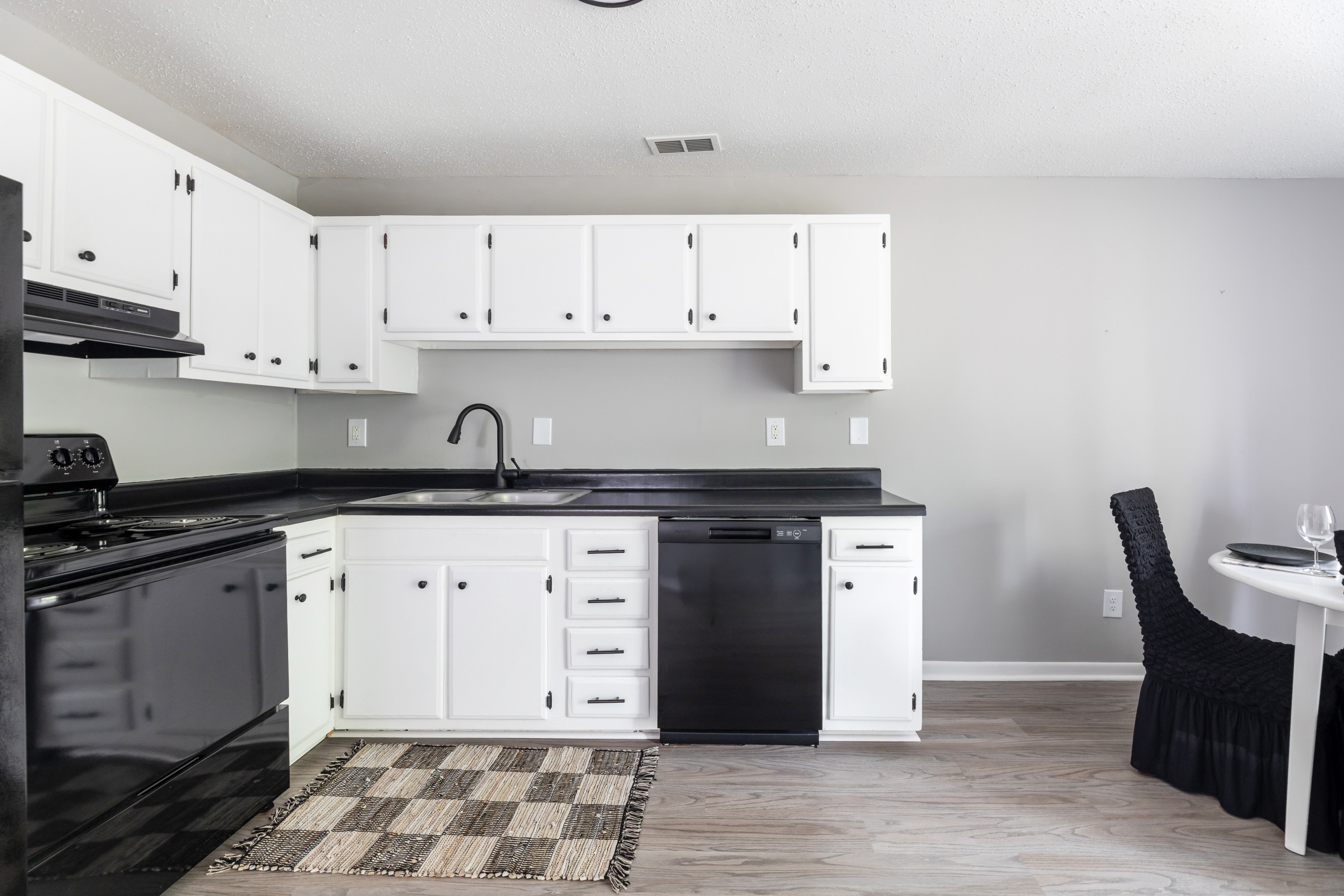 Kitchen With Black Appliances at Lauradale, Jacksonville, NC